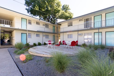 a courtyard with a table and chairs in front of a building at The Junction, Tennessee, 38111